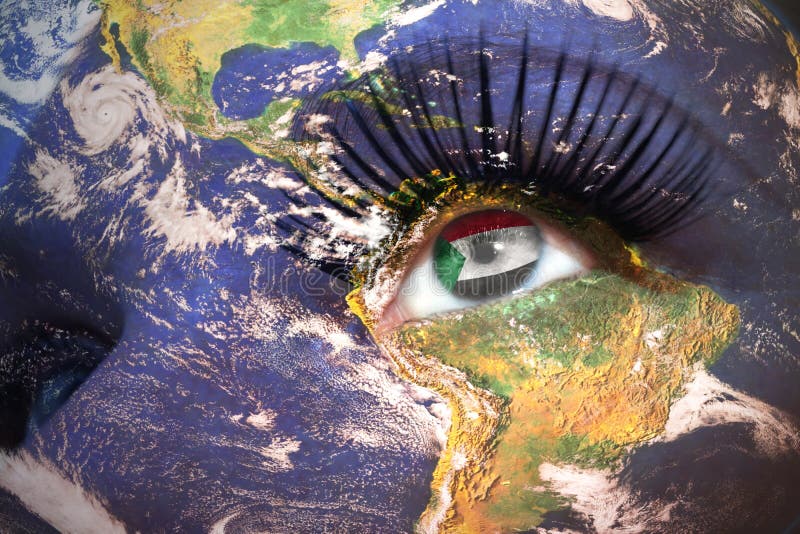 Womans face with planet Earth texture and sudanese flag inside the eye. stock photography Womans face with planet Earth texture and sudanese flag inside the eye. stock photography