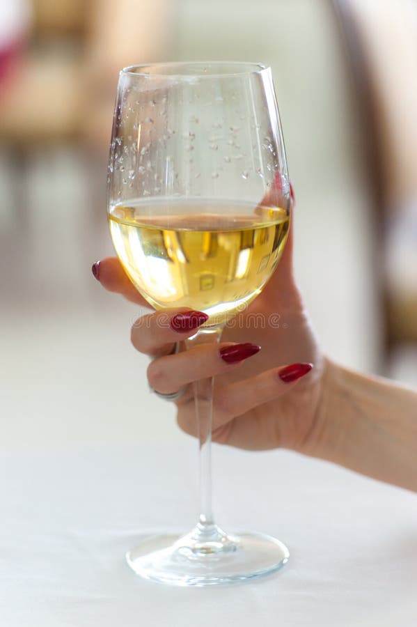Womans Hand Holding Wine Glass Stock Image - Image of fingernails, lady
