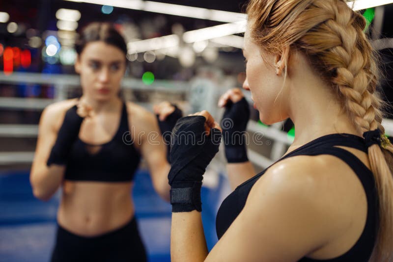 Women boxing in the ring, girl in red is knocked out, top view, box  competition. Female boxers in gym, kickboxing sparring partners in sport  club, pun Stock Photo - Alamy