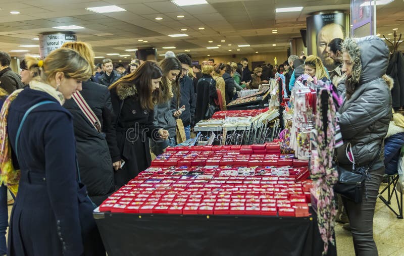 Women buying martisoare to celebrate beginning of spring on Mar