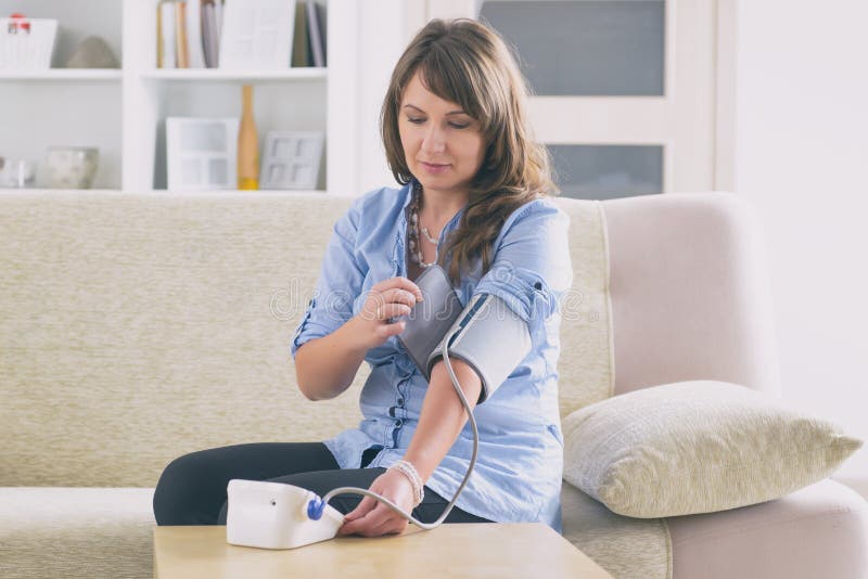 Checking Blood Pressure at Home Stock Image Image of meter, caucasian