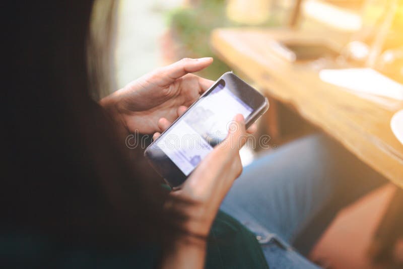 Women connecting phone to the car media system