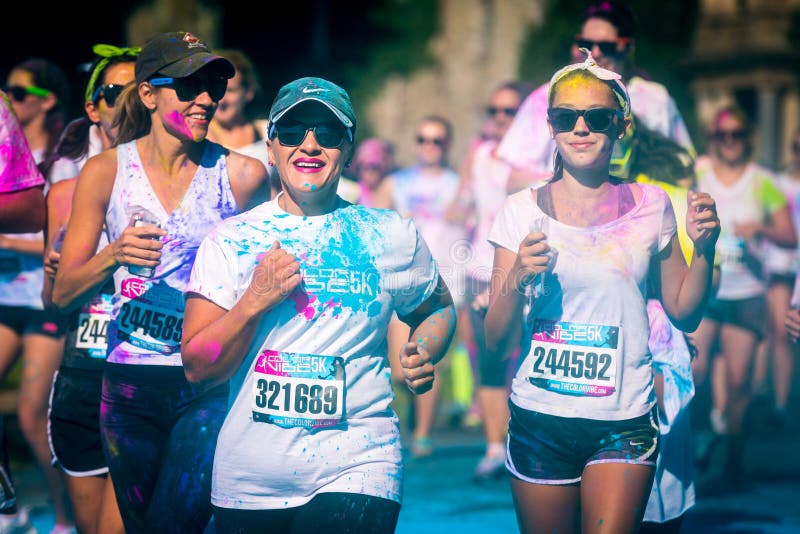 Women couple runs the Color Vibe 5K race stock photo Women couple runs the Color Vibe 5K race stock photo