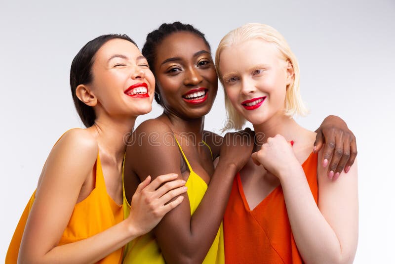 Women with different skin color having bright red lips stock image Women with different skin color having bright red lips stock image