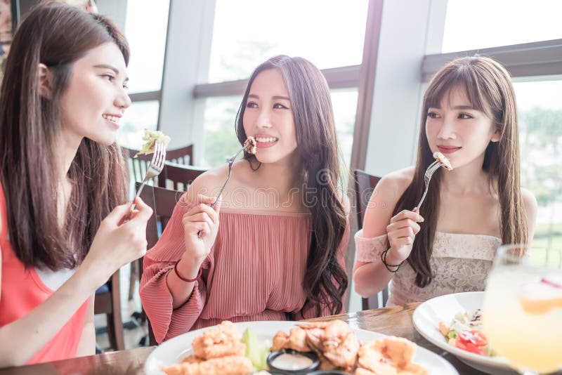Beauty women smile and dine in restaurant. Beauty women smile and dine in restaurant