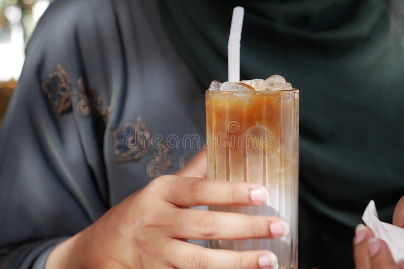 Women drinking iced late closeup royalty free stock photography