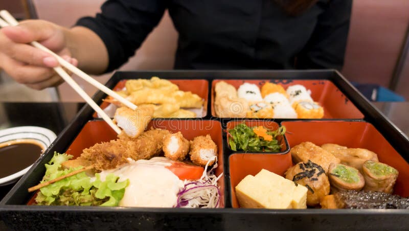 Women eating bento box set