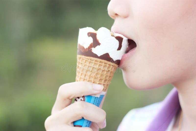 Women Eating An Icecream Cone Stock Photo Image 35579100