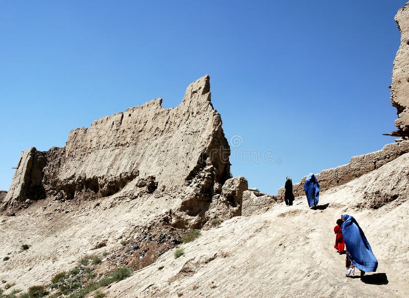 Women and girls walk over the wall of the citadel in Ghazni, Afghanistan. Women and girls walk over the wall of Ghazni citadel in Ghazni, Afghanistan. The woman