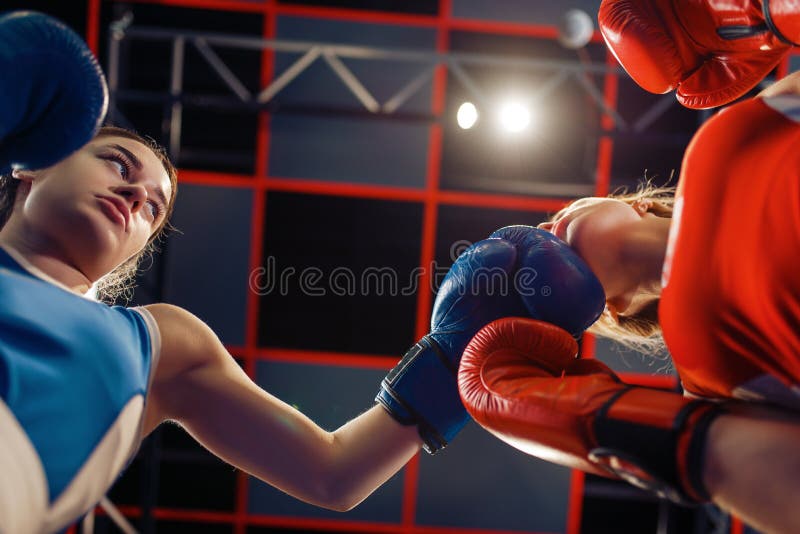 Women boxing in the ring, girl in red is knocked out, top view, box  competition. Female boxers in gym, kickboxing sparring partners in sport  club, pun Stock Photo - Alamy