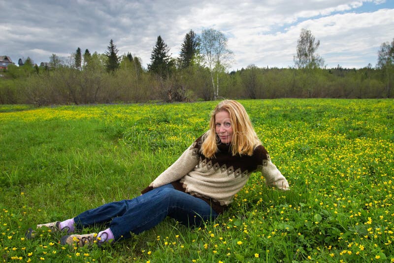 Women on green field.