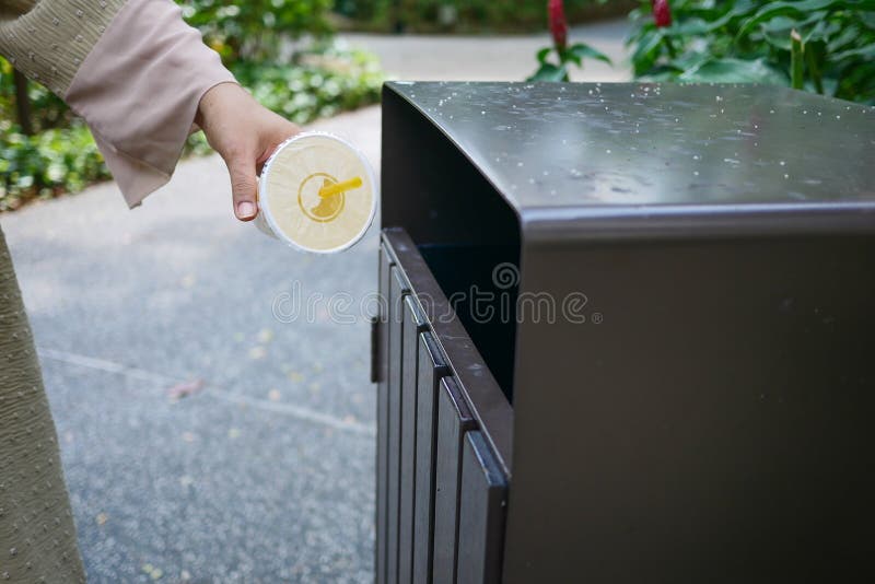 Women Hand Throwing an Empty Plastic Water Bottle in the Garbage Trash ...