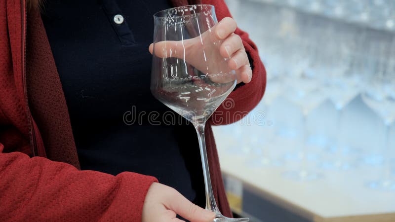 https://thumbs.dreamstime.com/b/women-hands-hold-large-wine-glass-buying-dishes-store-girl-chooses-transparent-long-stem-camera-shoots-closeup-model-205039061.jpg