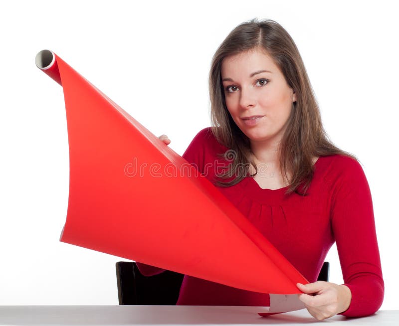 Women hold red wrapping paper