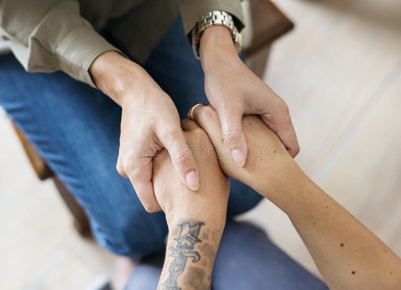 Women holding hands to support each other royalty free stock image Women holding hands to support each other royalty free stock image