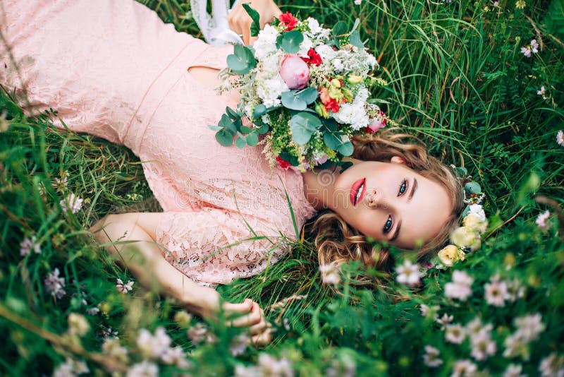 Women Lying On Green Meadow