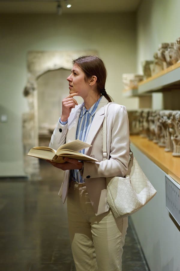Women in the Museum Looks at Art Exhibitions. Stock Photo - Image of