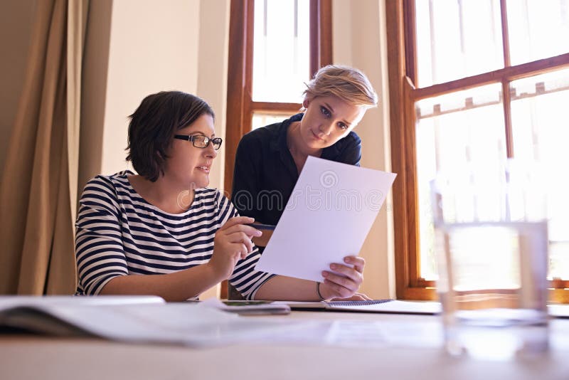 Women, planning and collaboration on report in office with teamwork, support and feedback on project. People, talking stock photos