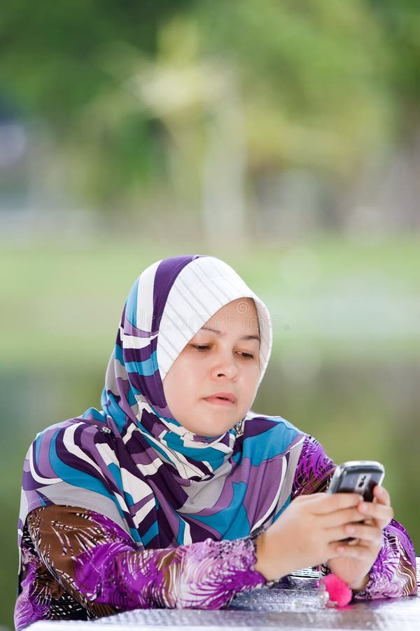 Women playing her mobile phone