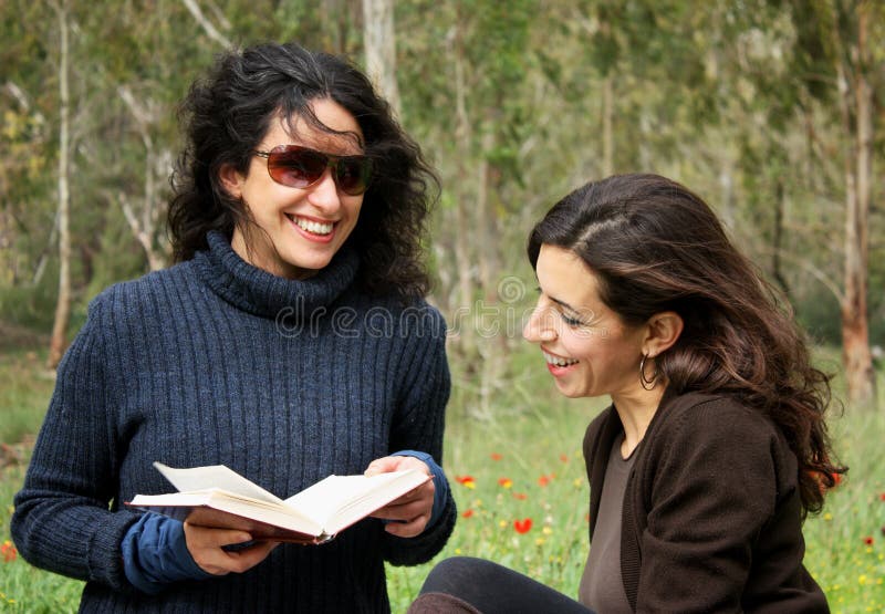 Women reading a book stock image. Image of learning, hair - 12810231