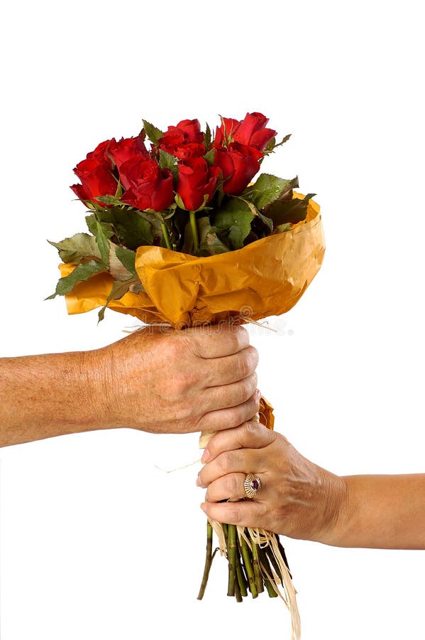 A women receiving red roses from a man