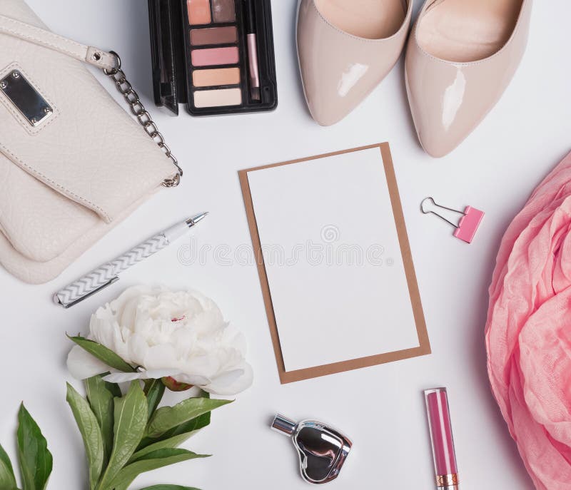 Women`s accessories on white background and blank paper royalty free stock image Women`s accessories on white background and blank paper royalty free stock image