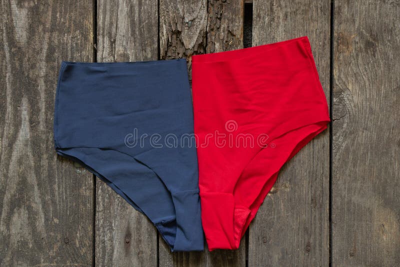 Women S Blue and Red Panties Lie on a Wooden Table, Women S