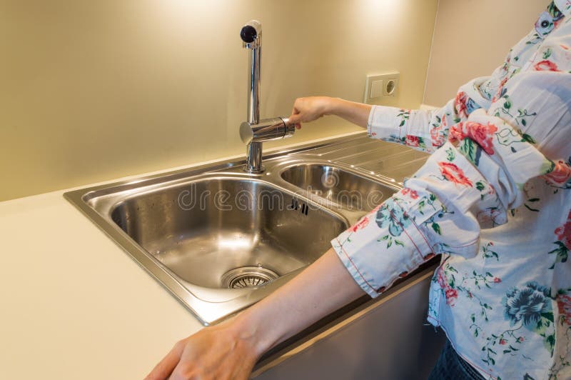 Women S Hand Holding Water Tap At Sink In The Kitchen Stock Image Image of sink, indoors 79985211