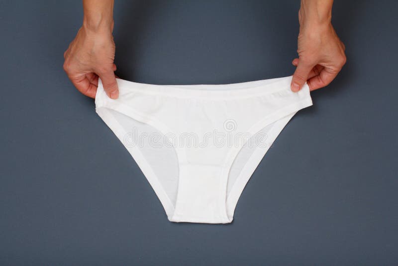 Women`s Hands with Beautiful Panties on Blue Background Stock Image ...