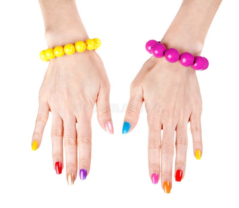 Women s hands with multi-colored nail polish