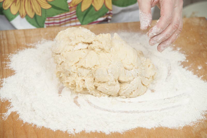 Women's hands prepairing fresh yeast dough. Raw fresh yeast dough stock images, royalty-free photos and pictures