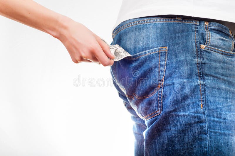 Women`s hands pulling the dollar bill out of men`s jeans back po