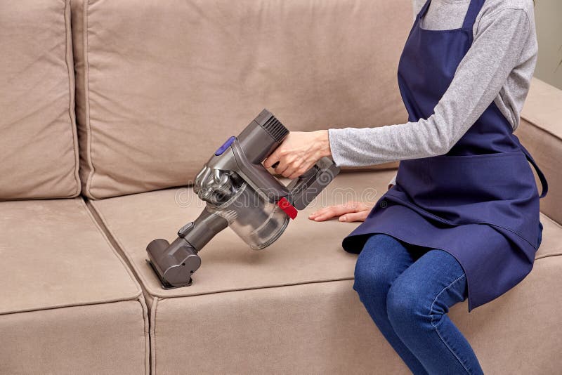 Women`s Hands Removing Dust from the Sofa Home Routine. Stock Photo Image of dirt