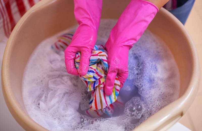 Women`s Hands Wash Clothes in the Basin. Stock Photo Image of bubble