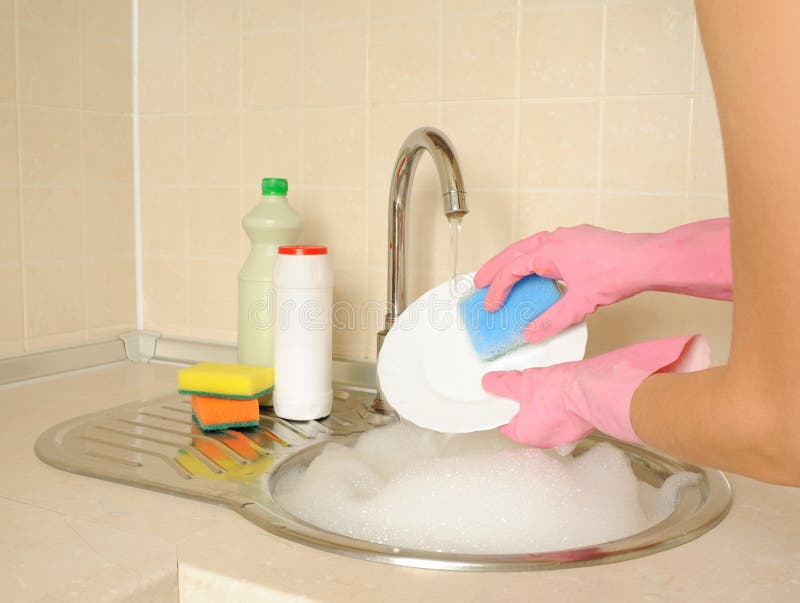 Women s hands washing dish