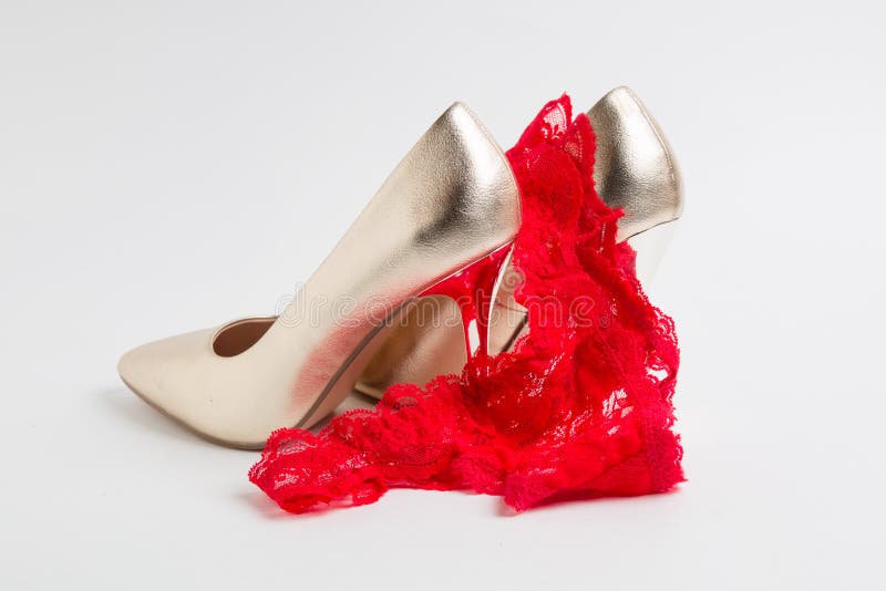 Women`s high-heeled shoes and panties on white background royalty free stock photo Women`s high-heeled shoes and panties on white background royalty free stock photo