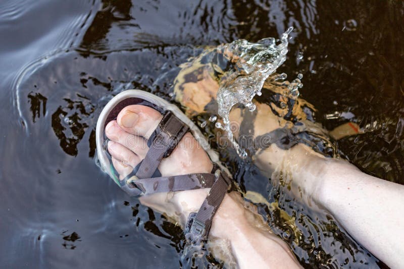 Women& X27;s Legs in Sandals Soaked in the Lake. Feet Immersed in the ...