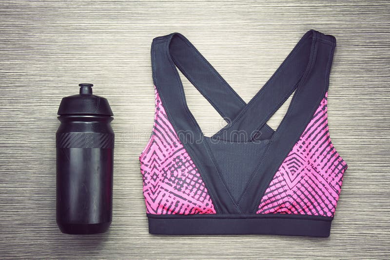 Women`s Sports Bra and Black Bicycle Water Bottle. Sport