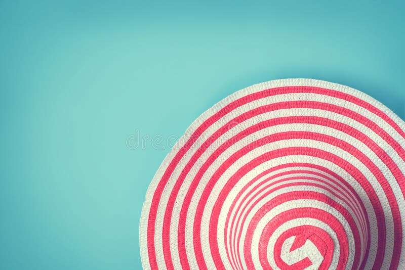 Women`s striped summer romantic hat for beach holiday. Top view stock photo Women`s striped summer romantic hat for beach holiday. Top view stock photo