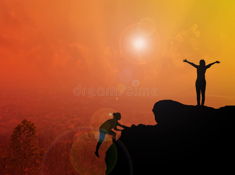 Women silhouette climbing and standing on cliff with blurred cit