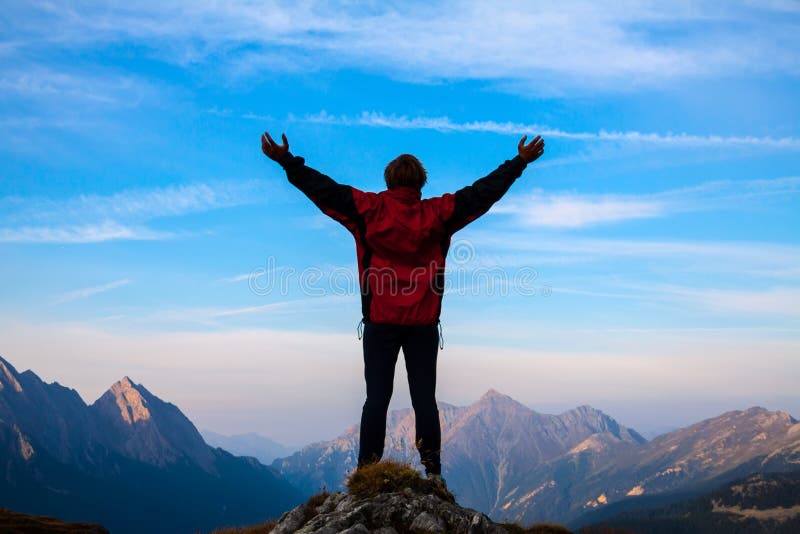 Women silhouette on the top of mountain