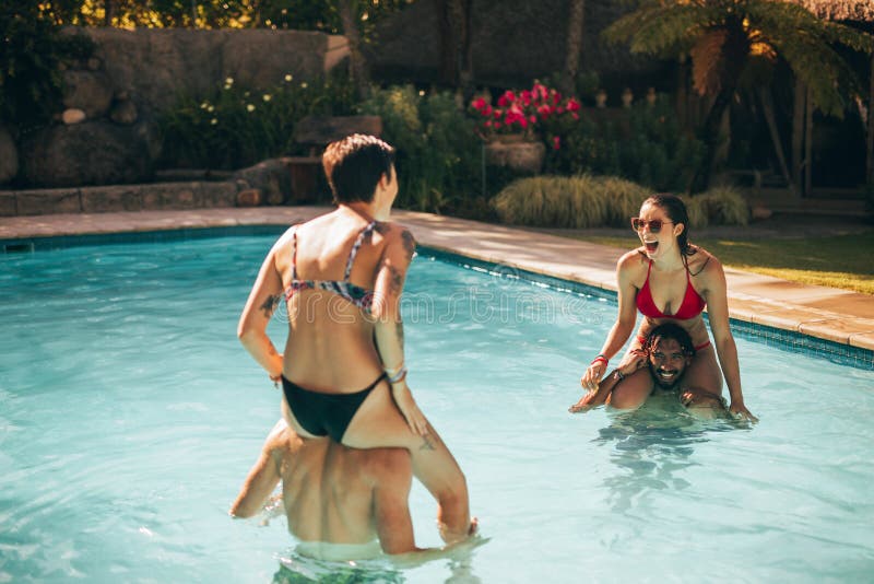 Group Of Friends Having Fun In The Pool Stock Image Image Of Couples