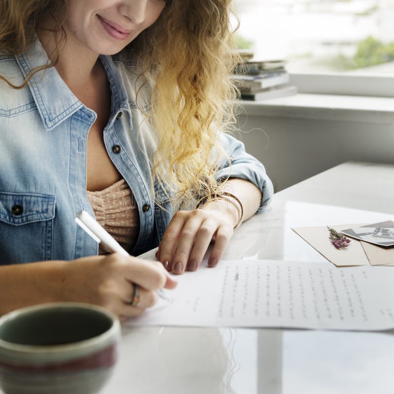 Women Smiling Writing Letter Concept royalty free stock photo