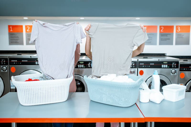 Women Sorting Clothes in the Laundry Stock Image - Image of ...