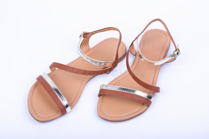 Women's brown sandals on white background. top view. Women's brown sandals on white background. top view.