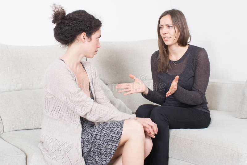 Women talking stock images