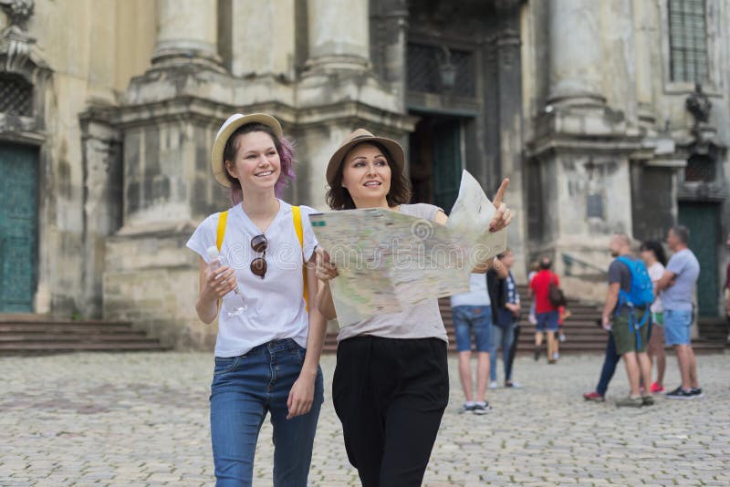 Women tourists mother and daughter teenager with map royalty free stock image Women tourists mother and daughter teenager with map royalty free stock image