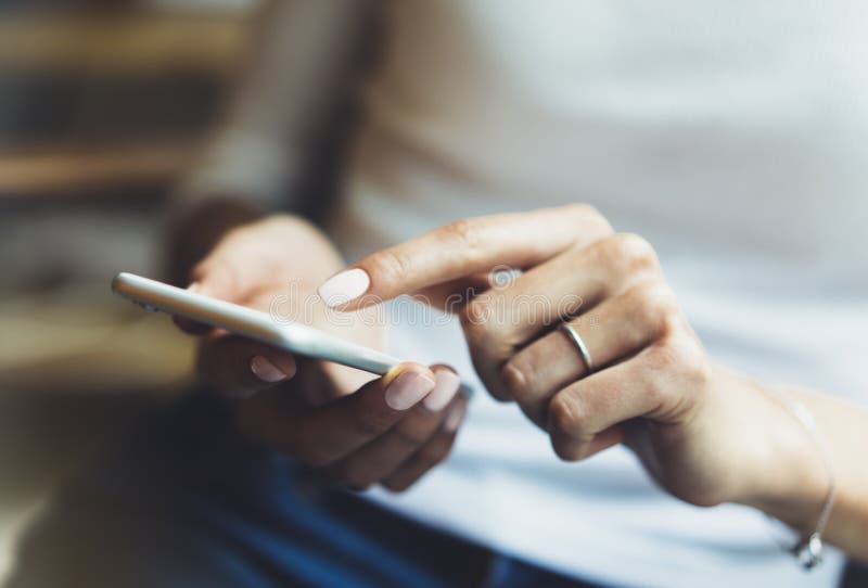 Women using smartphone , hipster manager holding mobile gadget, girl texting message sms, connect concept, blur background