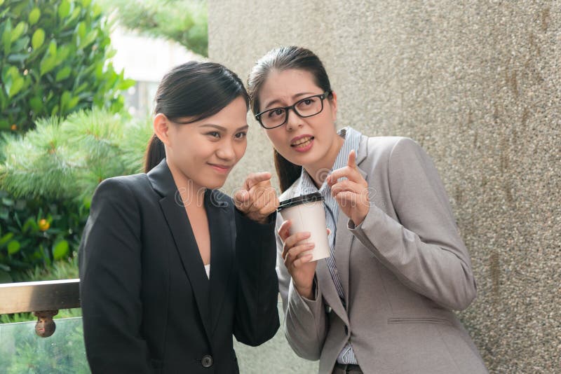 Women workplace bullying conversation stock photo Women workplace bullying conversation stock photo