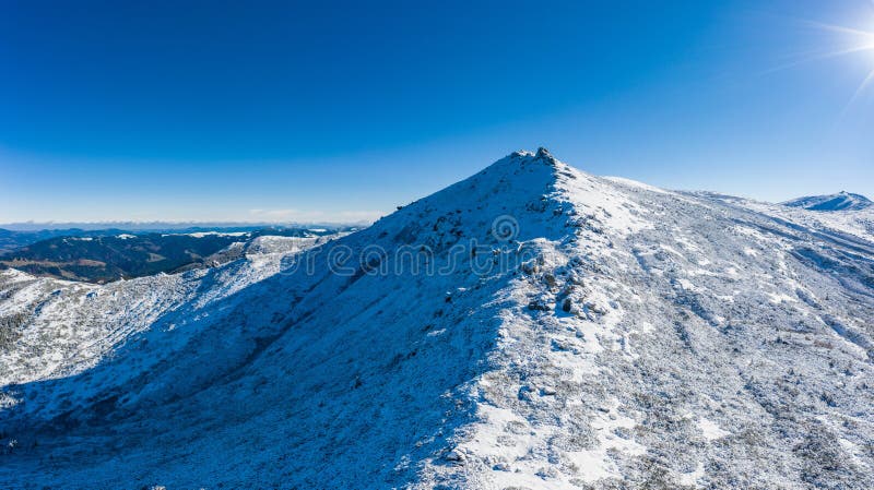 Wonderful landscapes of the Carpathian mountains covered with the first snow in Ukraine near the village of Dzembronya